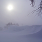 Sunday: Patchy blowing snow. Mostly sunny, with a high near 31. Windy. 